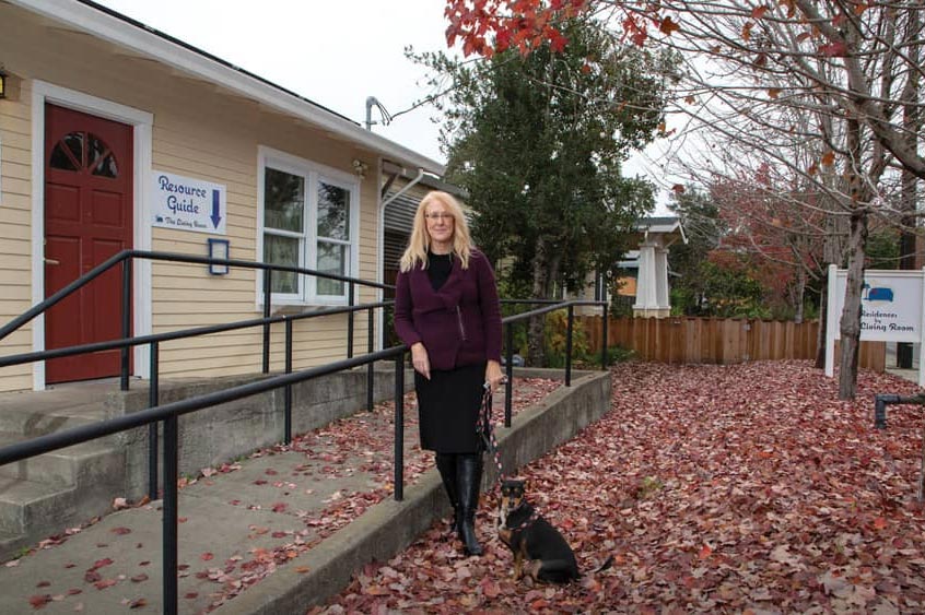 Cindy Pasko in front of new Residence building